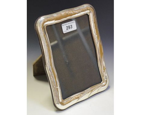 A Continental silver shaped rectangular easel photograph frame, marked 925