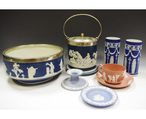 A Wedgwood Jasperware silver plated mounted fruit bowl; a biscuit barrel; a boudoir candlestick; a pair of cylindrical vases,