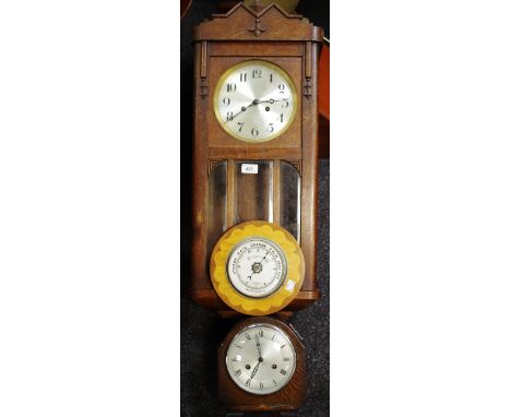 An oak wall clock, c.1940; an oak mantel clock, c.1935; an aneroid barometer (3)