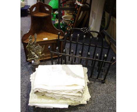 A small early 20th century oak corner cupboard and shelving unit; a wrought iron magazine rack; cast metal door bell; vintage