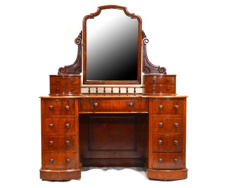Victorian mahogany twin pedestal dressing table, central arched mirror above trinket drawers, twin pedestald with nine drawer