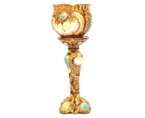 Victorian majolica jardiniere on stand, moulded with shells and scrolls, overall height 83cm.Condition report:Hairline cracks