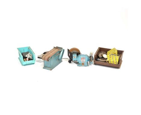 Table top grinder and a belt sander along with three boxes of accessories.