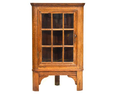 Small oak corner cabinet, glazed door, bracket feet, depth 42cm, height 97cm; a craftsman made magazine rack, rectangular top
