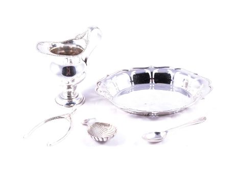 Silver cream jug, Barker Brothers, Chester 1907, 11.5cm, silver dish, caddy spoon, sugar nips and a coffee spoon, 7.3ozt tota