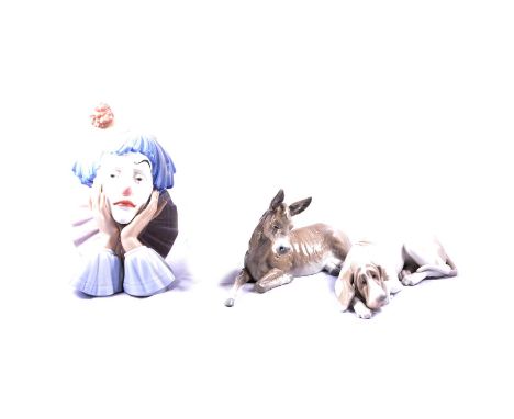 Nine Lladro porcelain models, including a bust of a clown, G2-J, 31cm, lady with broken parasol, lady with basket of grapes, 