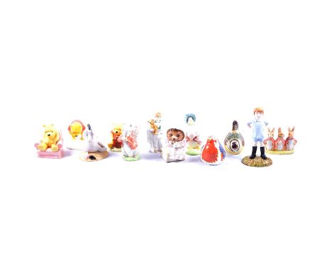 A Royal Doulton Winnie the Pooh and the Honeypot; Winnie the Pooh in Armchair; Winnie the Pooh and the Paw-Marks; Eeyore's Ta