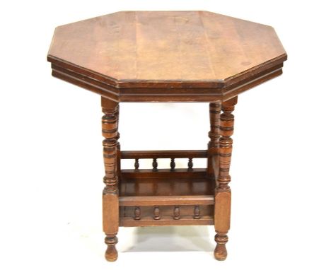 Octagonal window table, ringed supports joined by a galleried shelf, 74cm, height 69cm.