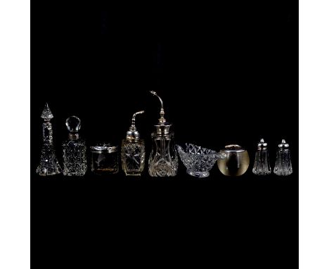 Small collection of silver-mounted glass perfume bottles, atomisers, etc.