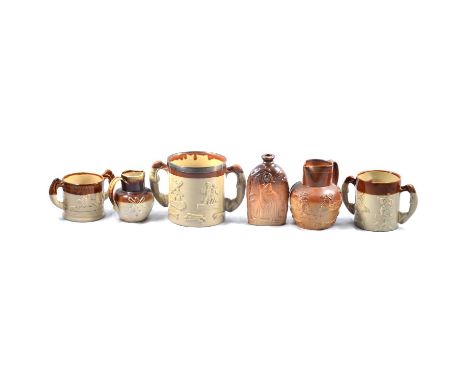 Stoneware Loving cup with a silver collar; two other stoneware loving cups; and two jugs; together with a stoneware flask, Mr