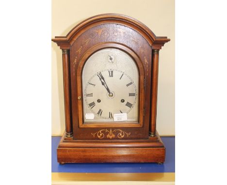 A mantle clock with hourly strike, mahogany case
