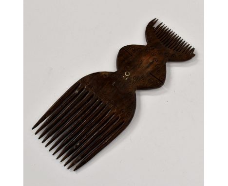 A tribal carved comb