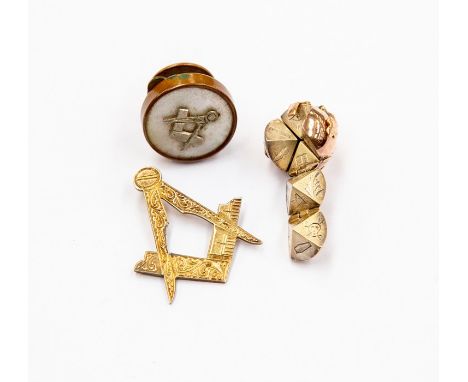 Masonic interest- A Masonic 9ct gold and silver folding ball pendant, size approx 14mm, a/f small clasp has detached, along w