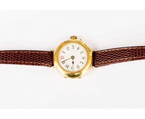 A ladies 18ct gold vintage watch, enamel round dial with numbers,&nbsp; circa 1930's, on brown leather strap, total gross wei
