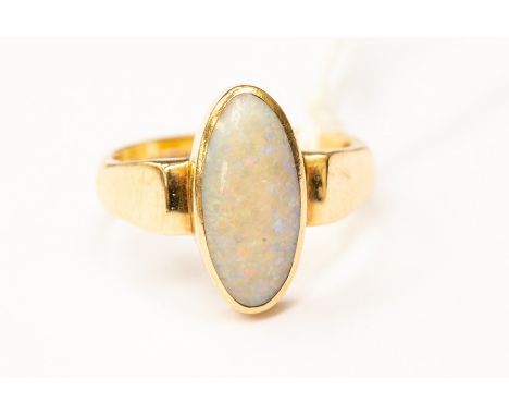 An opal set dress ring, oval elongated opal, rub over set in 9ct gold, size S, total gross weight approx 7 grams