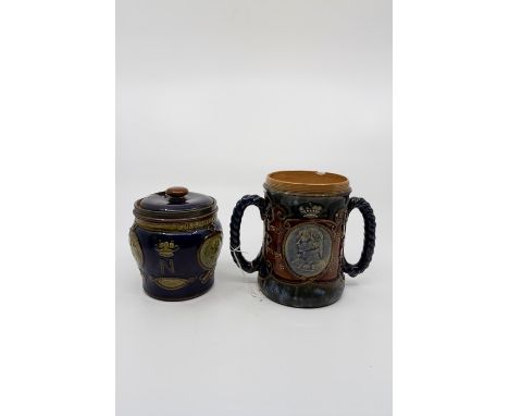 A Royal Doulton stoneware twin handled tankard commemorating Lord Nelson, the handles fashioned as rope, central medallion wi