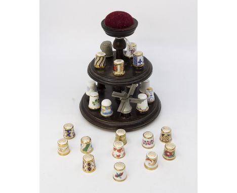 Pewter thimbles, and thimble variations, 20 English, Derby stand and 15 Royal Crown Derby thimbles, Wedgwood and British chin
