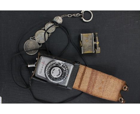 A WWI circa cigarette lighter, made in Switzerland with English patent number; together with a white metal coins (Markka and 