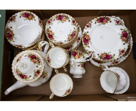 A Royal Albert tea service, including a teapot, plates, small plates, sandwich plates, cups and saucers, circa 1980's (Q)