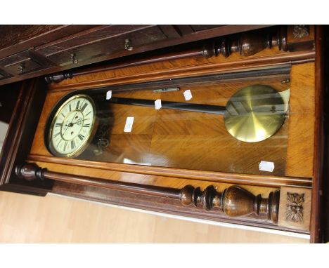 A late 19th Century pendulum wall clock, in mahogany case, approx 130 cms long