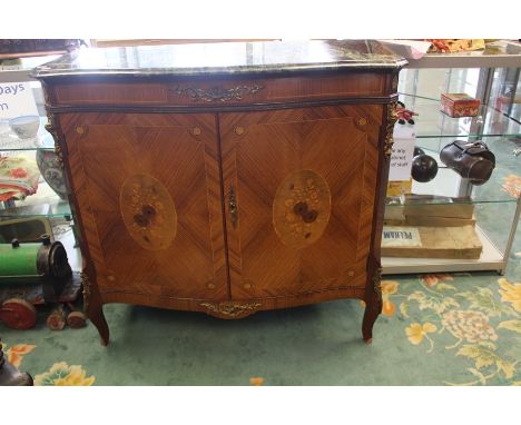 An early 20th Century Louis XV style kingwood, marquetry and gilt metal mounted serpentine commode, rouge and grey marble top