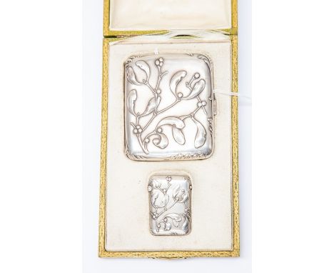 A cased set comprising of a white metal Cigarette case with gilt interior and a matching white metal Vesta case with an embos