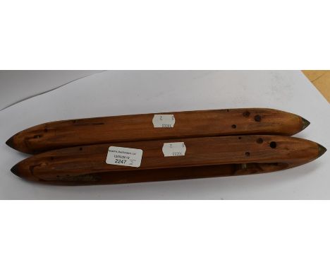 A pair of wooden weavers tools