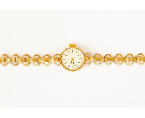 A 9ct gold ladies Rotary watch, round silvered dial with rope edge border, batons, dial diameter approx 13mm, integral fancy 
