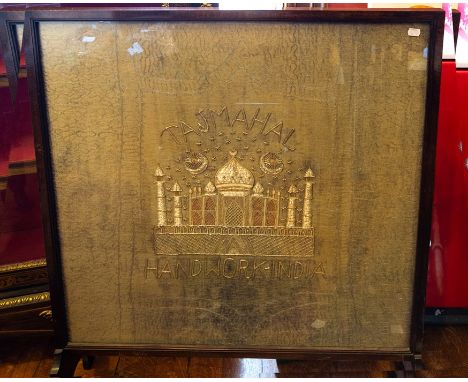 A late 19th Century Mughal textile panel, embroidered in gold and silver coloured threads with a view of the Taj Mahal on a f