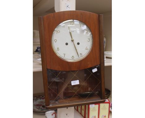 A 1930's wall clock, hourly strike and 1/2 hour
