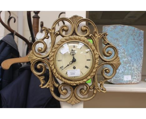 A 1930's wall clock striking 1/2 hour and hour
