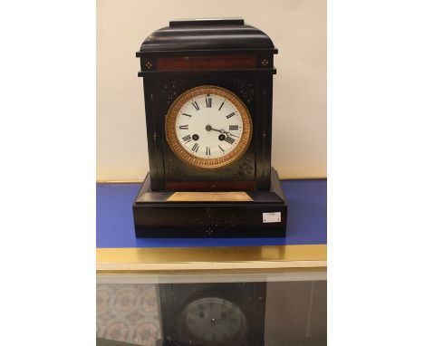 A mantle clock in slate, 1892, with key