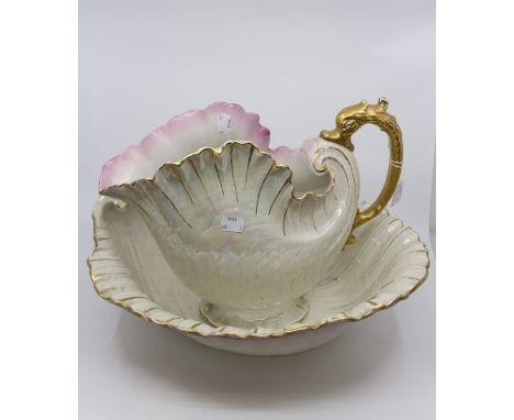 A large Continental pitcher and bowl in the form of shells - lustre background and gilt handle pitcher