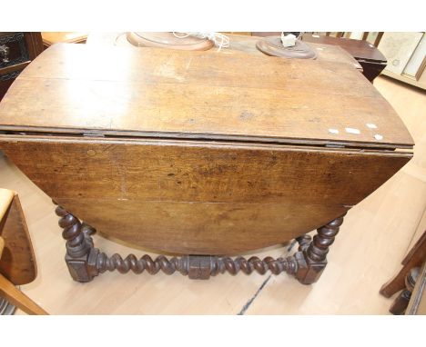 An 18th century barley twist gate leg table.