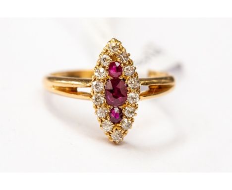 A Victorian style ruby and diamond cluster ring, marquise shaped head set with an three rubies with a diamond set surround, h