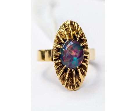 An opal set 18ct gold dress ring, circa 1970's, fancy mount set to the centre with an oval opal doublet, size P, total gross 