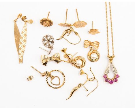 A&nbsp; 9ct gold pendant set with ruby type gems,&nbsp; on a fine 9ct gold chain, total gross weight approx 2.4gms, along wit