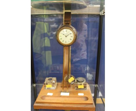 An Edwardian desk clock, mounted on ink stand with silver collars