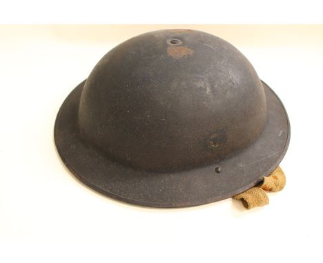 Post WW2 Belgian Army Steel Helmet. Belgian national colours decals to side.Complete with liner and chinstrap.