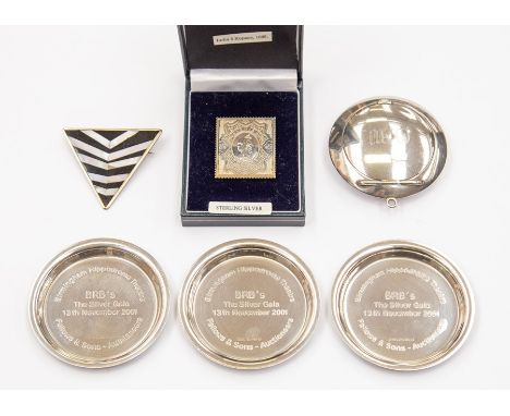 A small round silver compact with lid mirror Birmingham 1924, Levi &amp; Salaman three commemorative silver pin dishes, Birmi