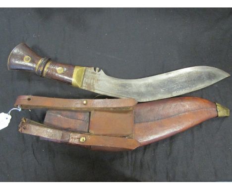 Kukri: A Great War Kukri. Large heavy blade 13" marked 'CO I (arrow) G' and '1917' with rack number 37. Bruised wooden grip w