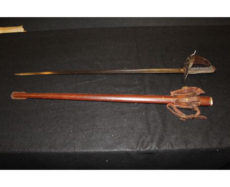 Sword - Victorian sword with leather field scabbard and frog, blade named 'Tower Hamlets Rifle Brigade'. Maker marked 'Robert