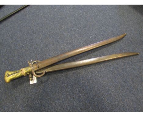 Chassepot Model 1866 Sabre bayonets in their steel scabbards. 1) Made at Tulle in March 1877. Good condition. 2) Made at CHAT