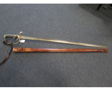 Sword: An Edward VII 1821 Pattern Artillery Officers sword in its leather field service scabbard. Sword appears to be lacquer