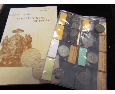 Indian Temple Tokens (15) a collection in an album page along with a scarce book: A Guide to the Temple Tokens of India by Ir