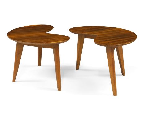 A pair of teak kidney shaped side tables,c.1950,The shaped tops on splayed and tapered birch tripod legsEach 31cm high, 50cm 