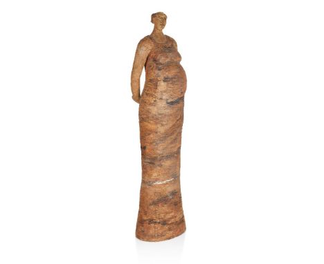 A stoneware sculpture of a woman standing full-length, c.1990, indistinctly signed, 'Mary S. R-----',Modelled as a stylised p