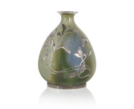 An Art Nouveau Continental porcelain vase decorated with silver overlay, c.1900, signed with monogram,The baluster form cover