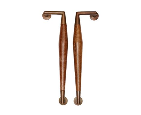 A pair of copper and beech door handles,c.1950/60,The tapered solid beech handles, with copper end mounts,Each 46cm long (2) 