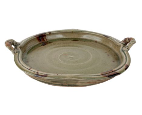 Takeshi Yasuda (Japanese b.1943), a large stoneware dish,c.1980,Of circular form, hand built with raised border and twist han